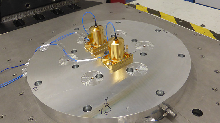 Am-RHUs on shaker table for vibration qualification testing.