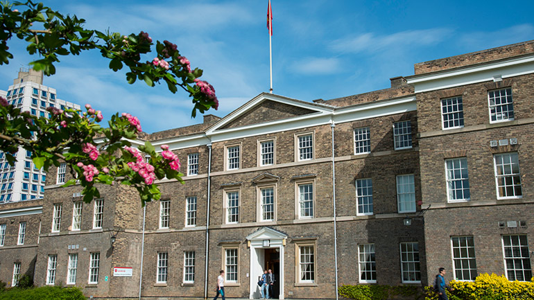 Students relax in front of the Fielding Johnson Building.