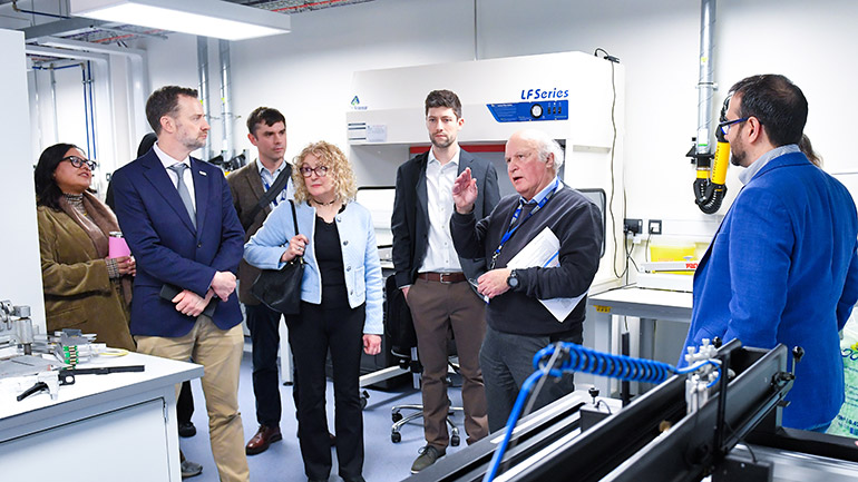 Professor Mark Sims with the visiting delegation.
