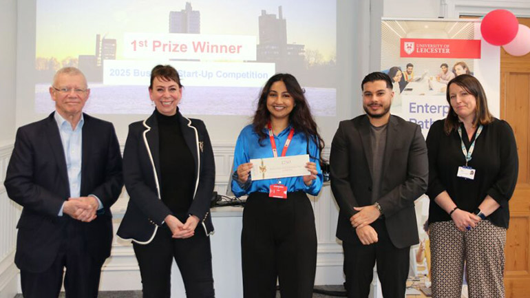 The 2025 University of Leicester Business Start-up Competition winner Leya Luhar receiving the prize from the judging panel. 