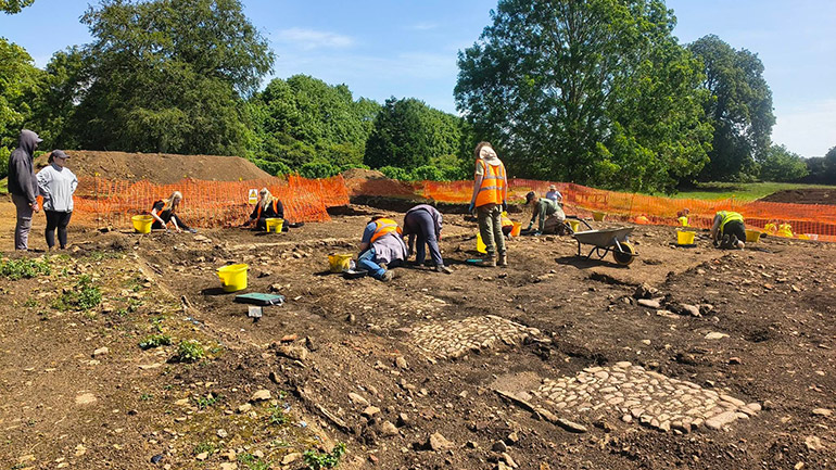 Students at work and recording medieval buildings at the Loddington field school.