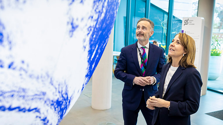 Will Wells, Chief Executive Officer of Space Park Leicester, with Liz Kendall MP with the Gaia sculpture.
