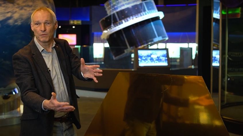 Professor Martin Barstow with a mock up of a mirror segment from the James Webb Space Telescope.