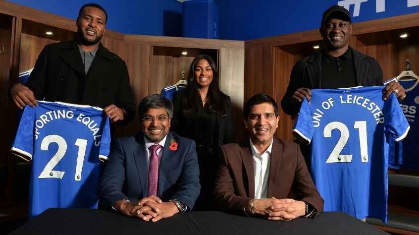 Wes Morgan, Professor Nishan Canagarajah, Jade Morgan, Arun Kang OBE and Emile Heskey in the home dressing room at Leicester City Football Club's King Power Stadium.