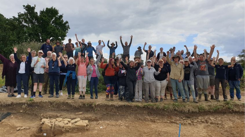 Volunteers and members of the local community celebrate on The Chester House Estate.