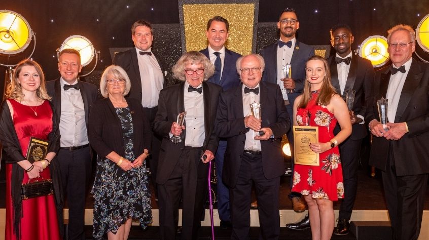 Michael Attenborough CBE with a group of people at the University of Leicester's Centenary Alumni Celebration.