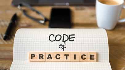 Code of practice written on a pad on a desk
