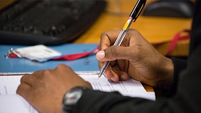 a student filling in a form