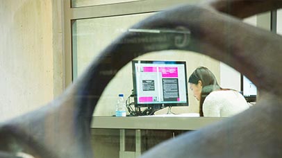 researcher using computer in lab