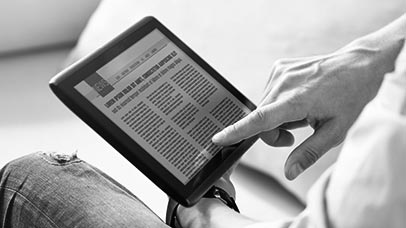 man reading the news on a tablet computer