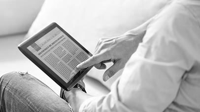 man reading the news on a tablet pc