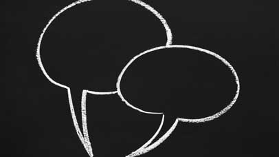 Speech bubbles draw on a chalkboard