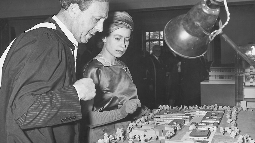 Her Majesty The Queen looking at model buildings