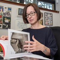 Image of woman reading a book