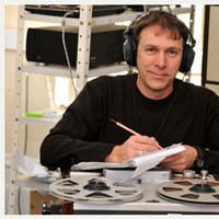 Photo of Colin Hyde working at a tape recorder
