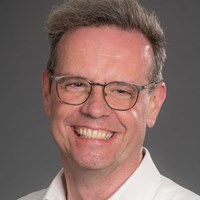 Photograph of Professor Ross Parry looking at camera smiling