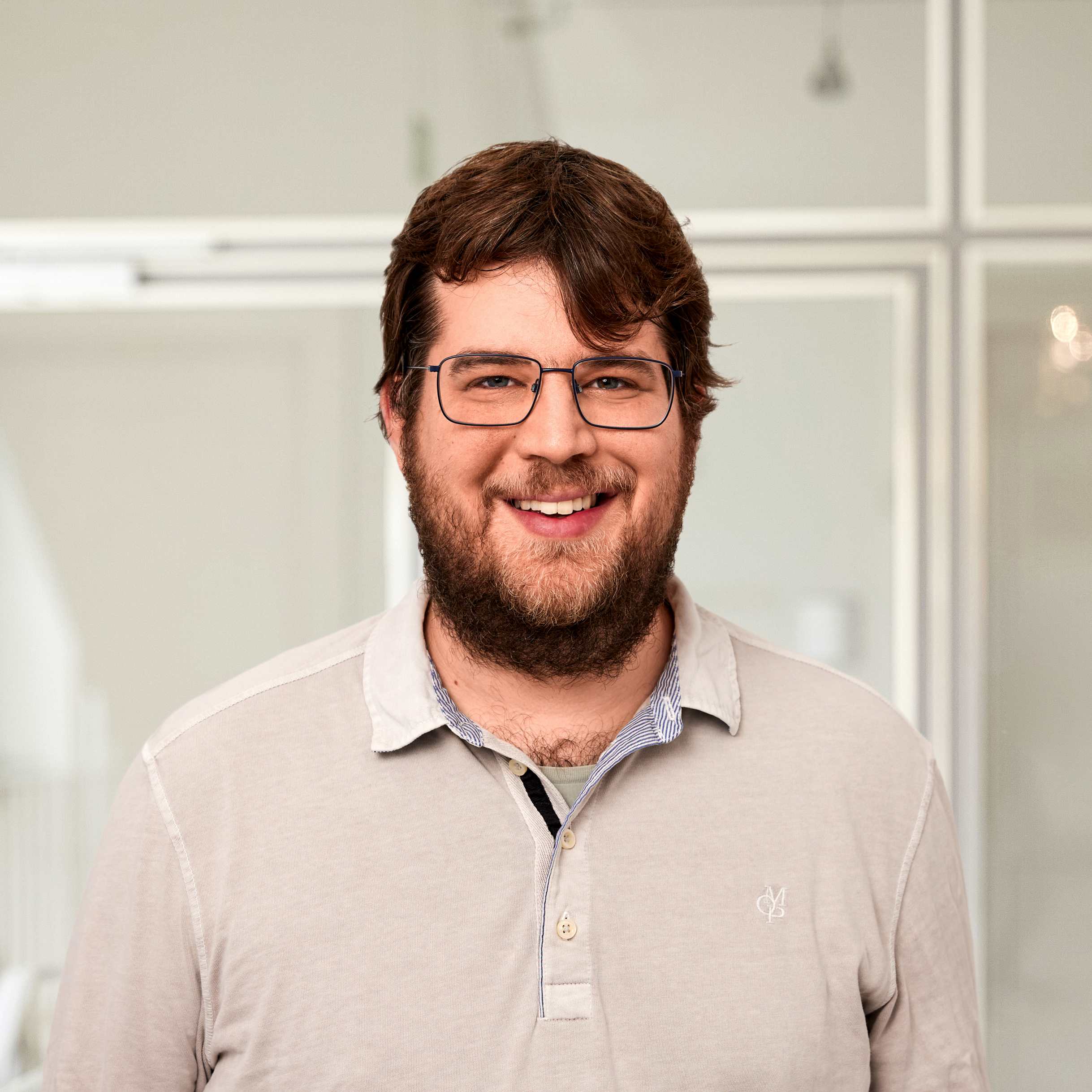 A portrait of Paul Ivo Schaefer, a man in his 30s.