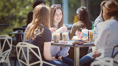 a group of students chatting outside