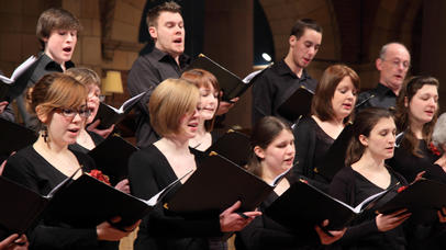 Student choir singing in a concert