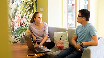 two students chatting in the oadby student village