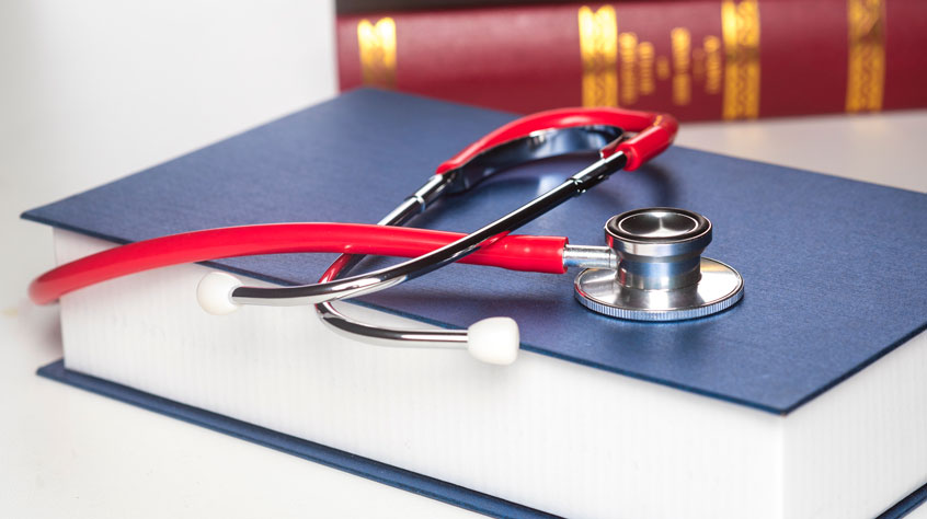 Stethoscope on a large medical book