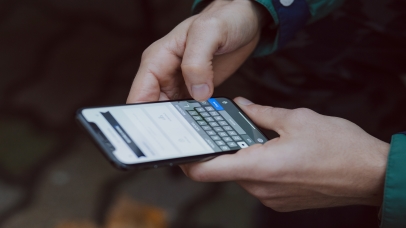 Man sending a message on phone