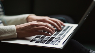 Person typing on a laptop