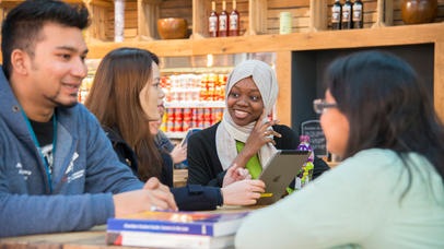 Students talk and laugh in the SU building