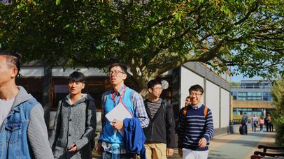 international students walking through campus