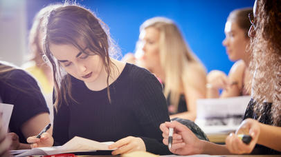 A student studies her book