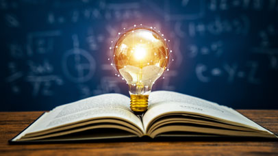 Lightbulb on a book
