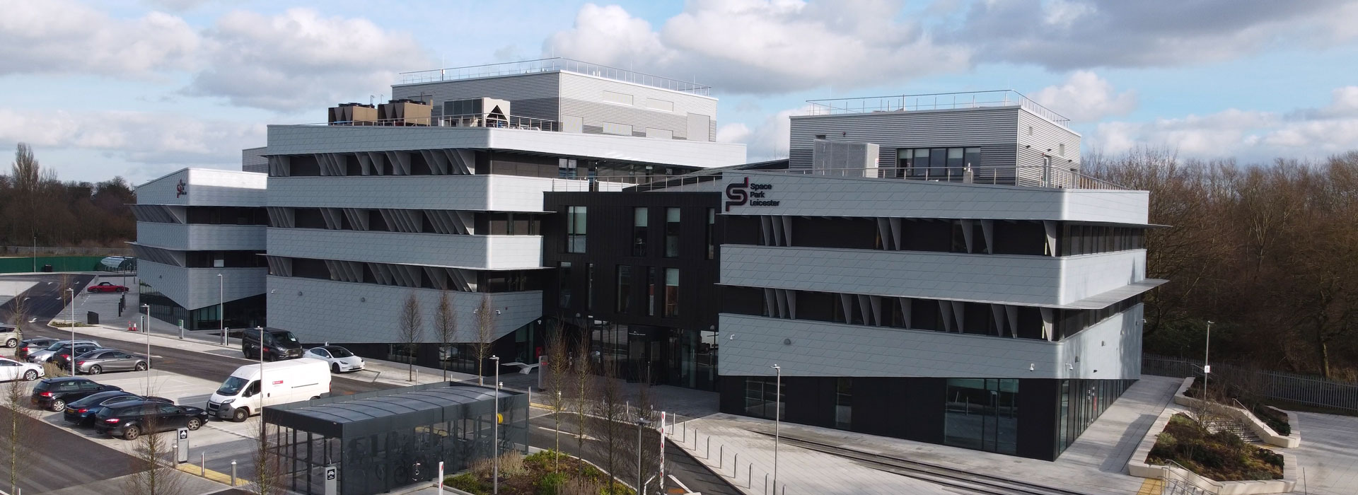 Wide view of a large building on an industrial park.