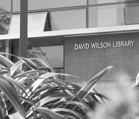 people walking away from the David Wilson Library with a red square filter displayed over the top