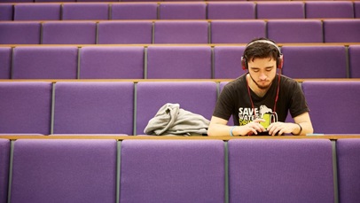 Student working with headphones