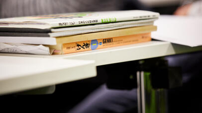 Pile of books on desk