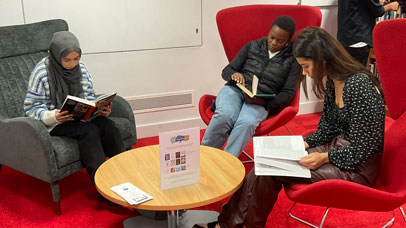 Group of students relaxing reading books