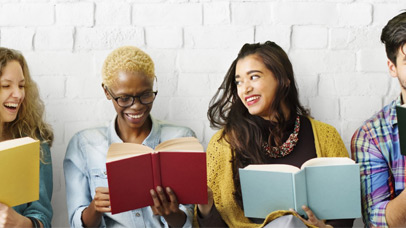 Students laughing and reading books