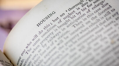 Image of a page in a book showing the chapter heading which says 'Housing'.