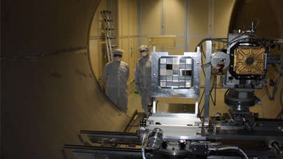 Scientists looking at equipment