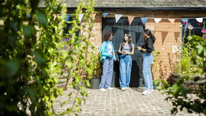Three students at the Brookfield allotment