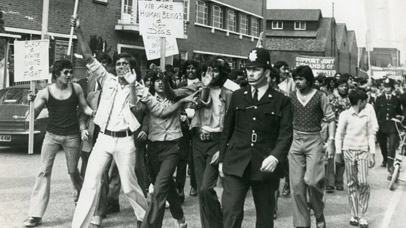 Black and white photograph of Imperial Typewriters employees striking for equal pay in 1974. 