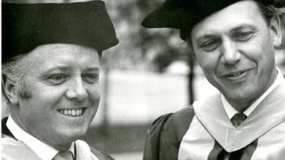 Black and white photograph of David and Richard Attenborough in academic dress, taken in 1970. 