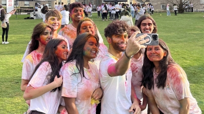 Group photograph of students taking a selfie on campus while attending the Holi event which was organised by the Hindu Society. 
