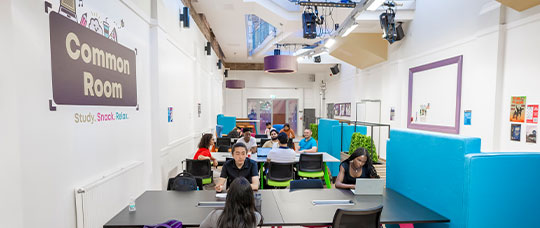 Photograph of large seating areas with students at desks.
