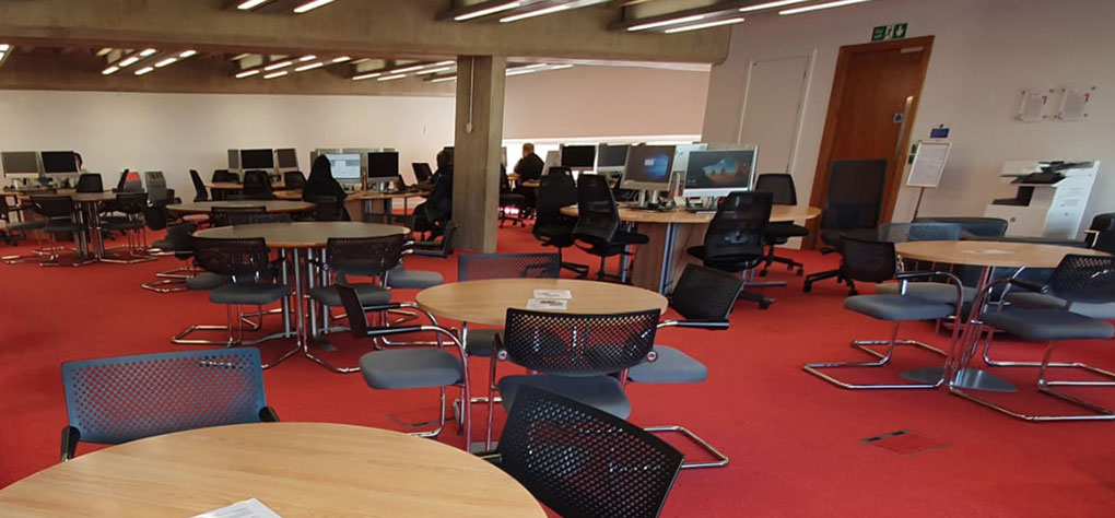 Doctoral College Reading Room, with various furniture and PC tables. The carpet is red.