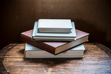 A pile of hardcover books