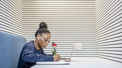 A student studying along in a booth