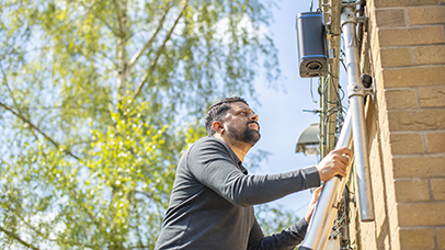 A CEHS team member adjusts equipment for detecting pollution levels