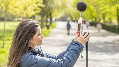 A member of the CEHS team testing noise levels with equipment