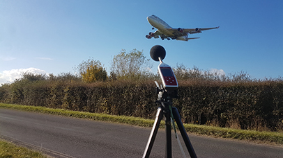 A device records and monitors noise levels as an aircraft flies overhead